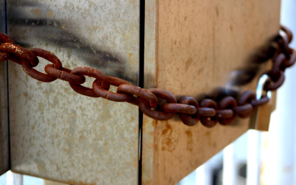 Rusty chains and a padlock.