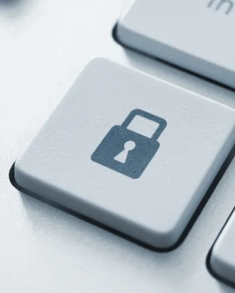 Image of a keyboard key with a "lock" icon on it.