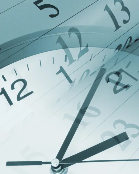 A montage of a clock face and a flipping calendar.