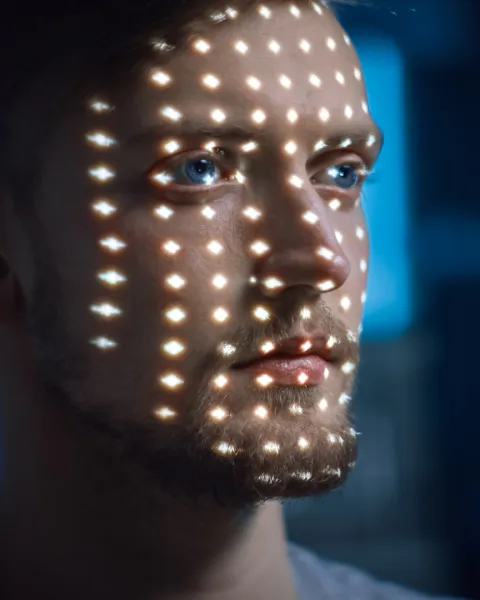 Handsome Young Caucasian Man is Identified by Biometric Facial Recognition Scanning Process.