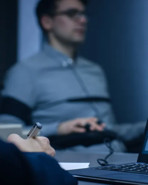 Computer shows physiological measures of a man undergoing a lie detector/polygraph test.