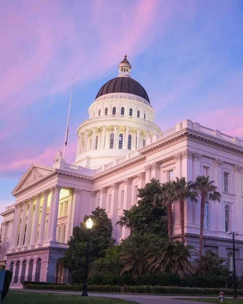 The State Capitol of California in Sacramento at dusk.