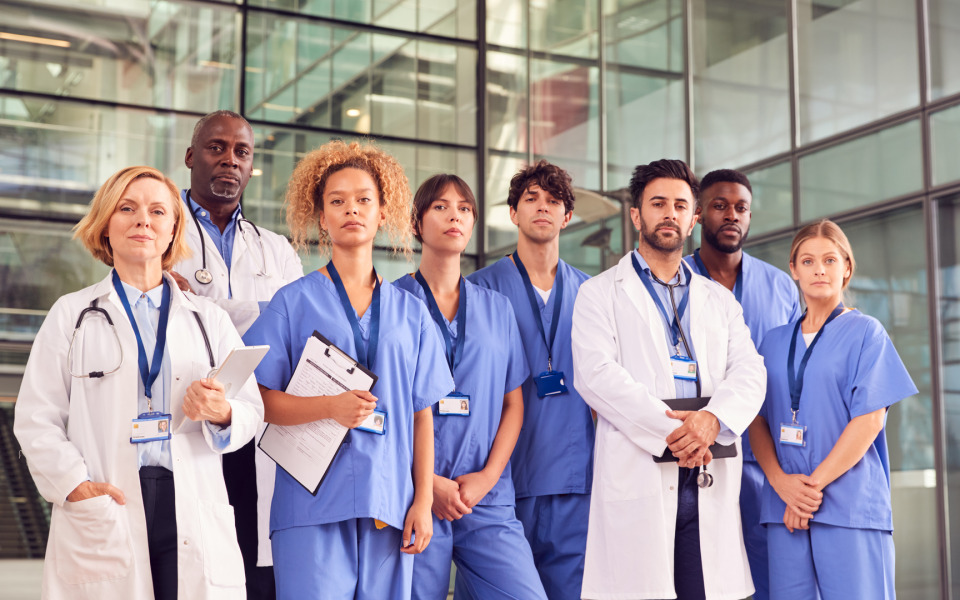 Group of medical doctors standing outside a facility