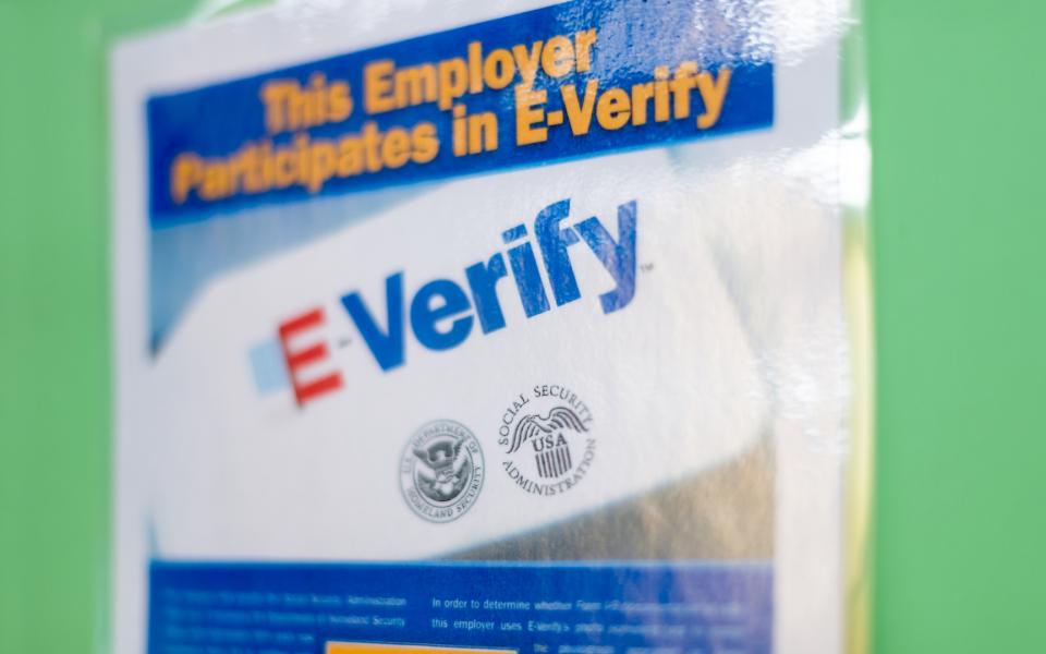 A notice that reads, "This employer participates in E-verify"