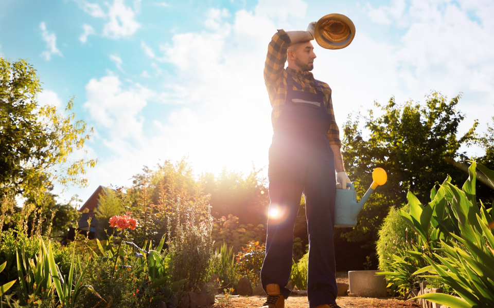 A landscaper exhausted from the heat.