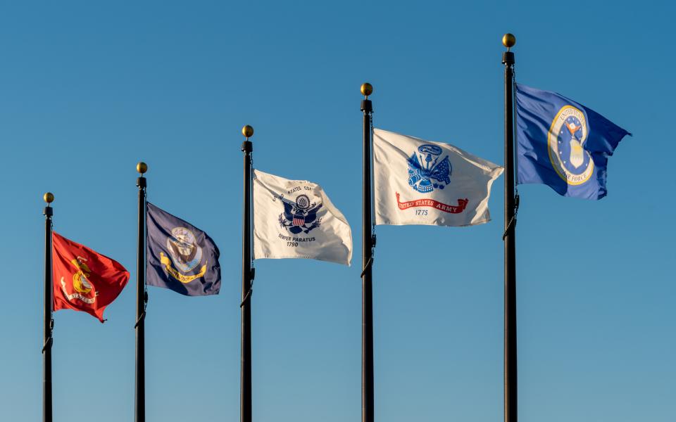 A row of flags representing the U.S. Military Branches.