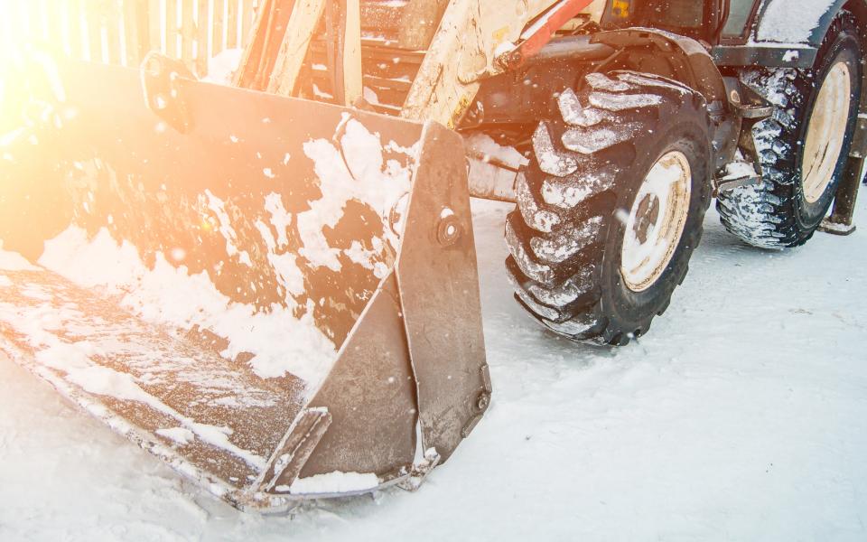 A back hoe in the snow.