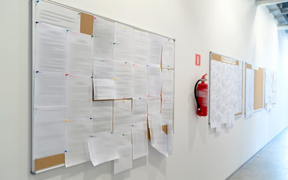 A View of a bulletin board crowded with notices.