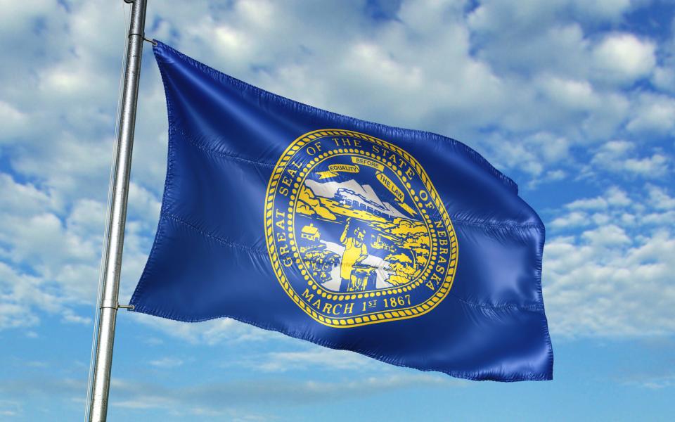 Close-up of the Nebraska State flag blowing in the breeze.