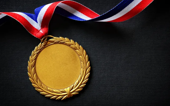 Close-up of a gold medal.