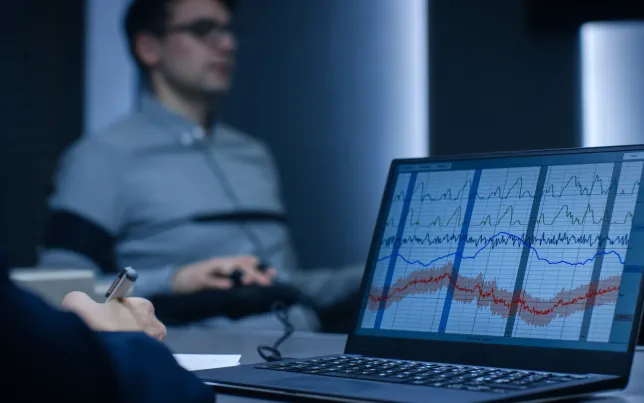 Computer shows physiological measures of a man undergoing a lie detector/polygraph test.