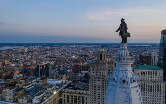 Aerial shot of Philadelphia with City Hall's William Penn statue in the foreground.