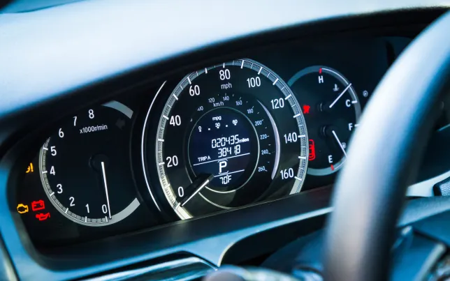 Close-up of a car's instrument panel/dashboard showing the speedometer and odometer.